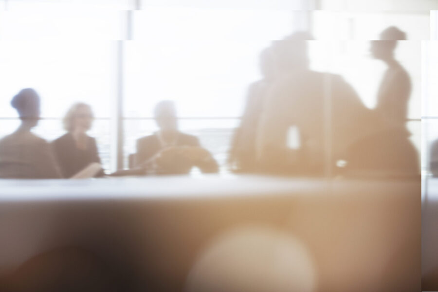 Silhouette of business people in meeting