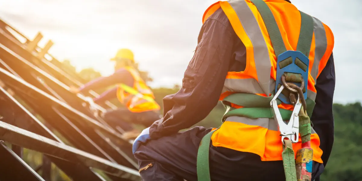 Safety equipment for working at height with hooks for the safety harness, focus on fall protection.