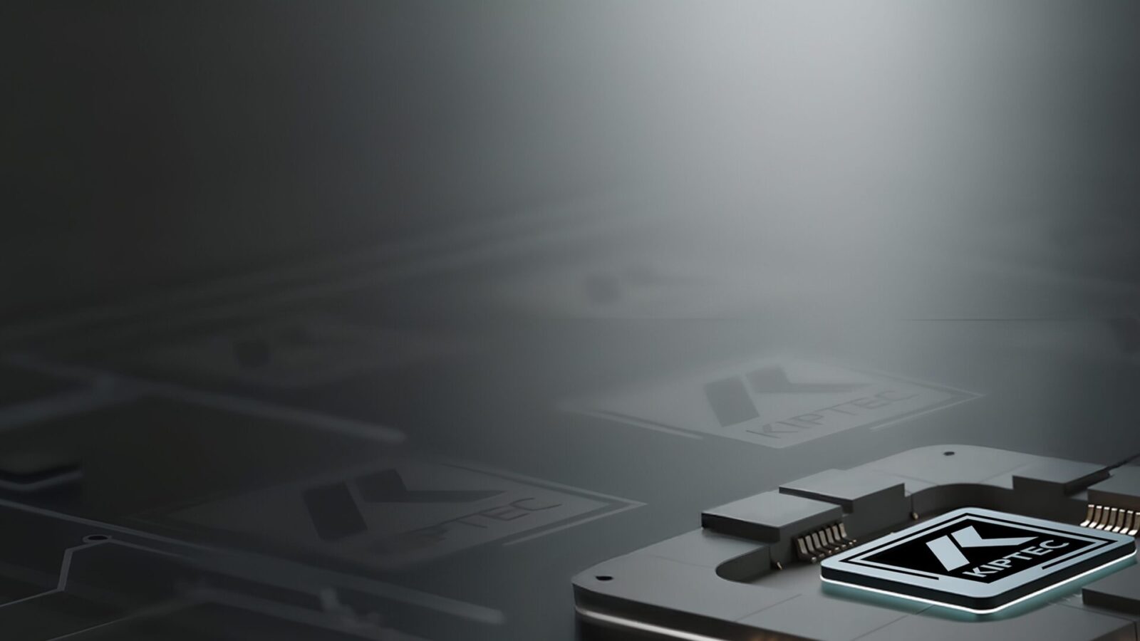 A close-up of a microchip with the KIPTEC logo, featuring sleek metallic components, sits on a reflective surface, with a blurred dark background creating a high-tech, futuristic atmosphere.